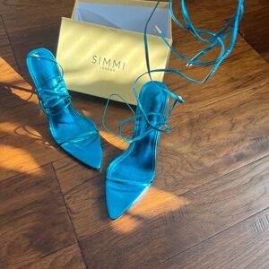 Metallic blue lace up heels